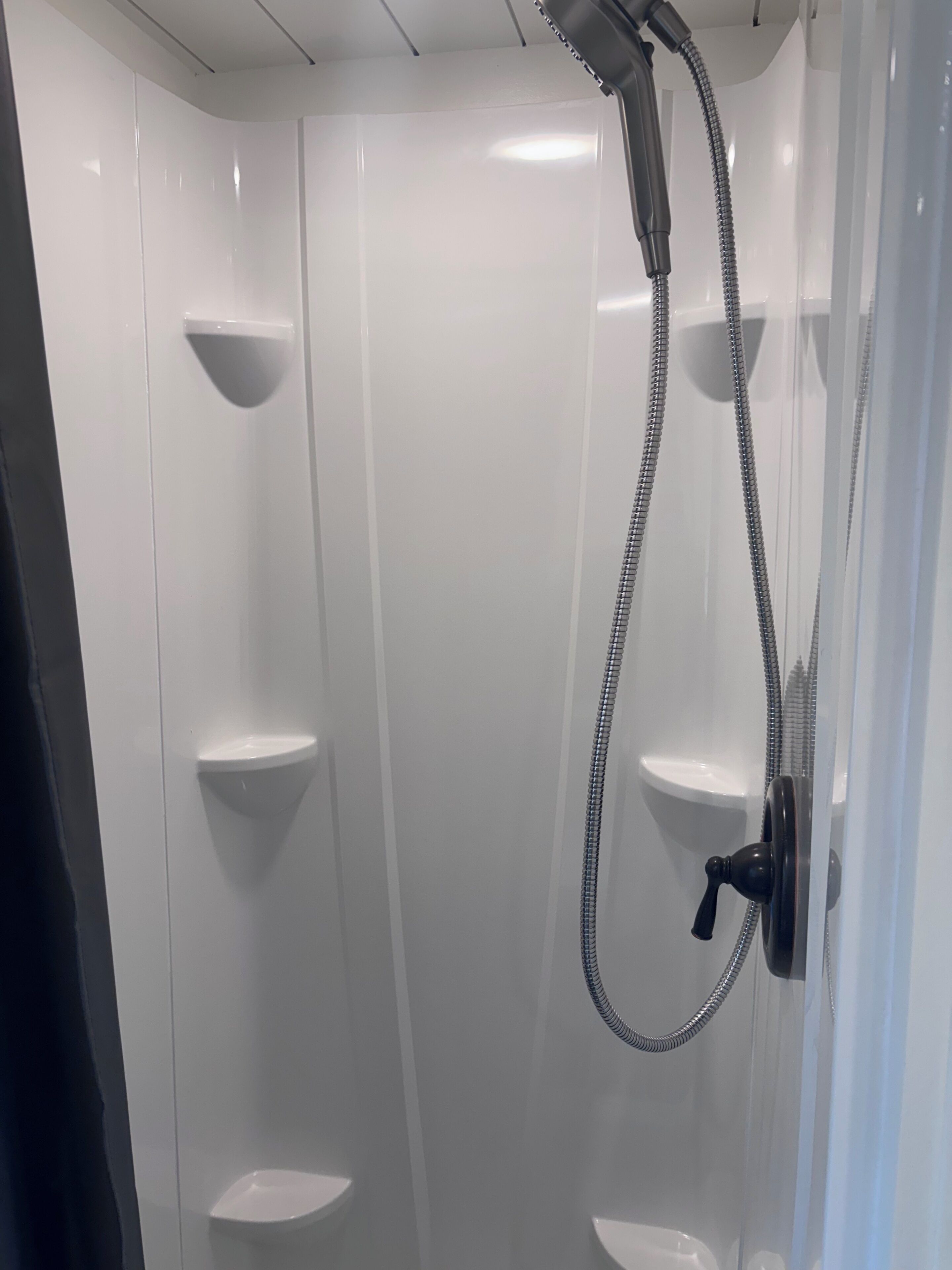 Shower, towels, soap, toilet paper