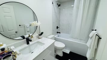 Hair dryer, towels, soap, toilet paper