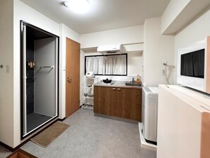 Standard Apartment | Private kitchen | Fridge, microwave, stovetop, cookware/dishes/utensils - Kishinosato Maison (Nishinari Ward)