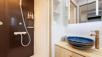 Economy Suite, Balcony, City View | Bathroom | Free toiletries, hair dryer, slippers, towels