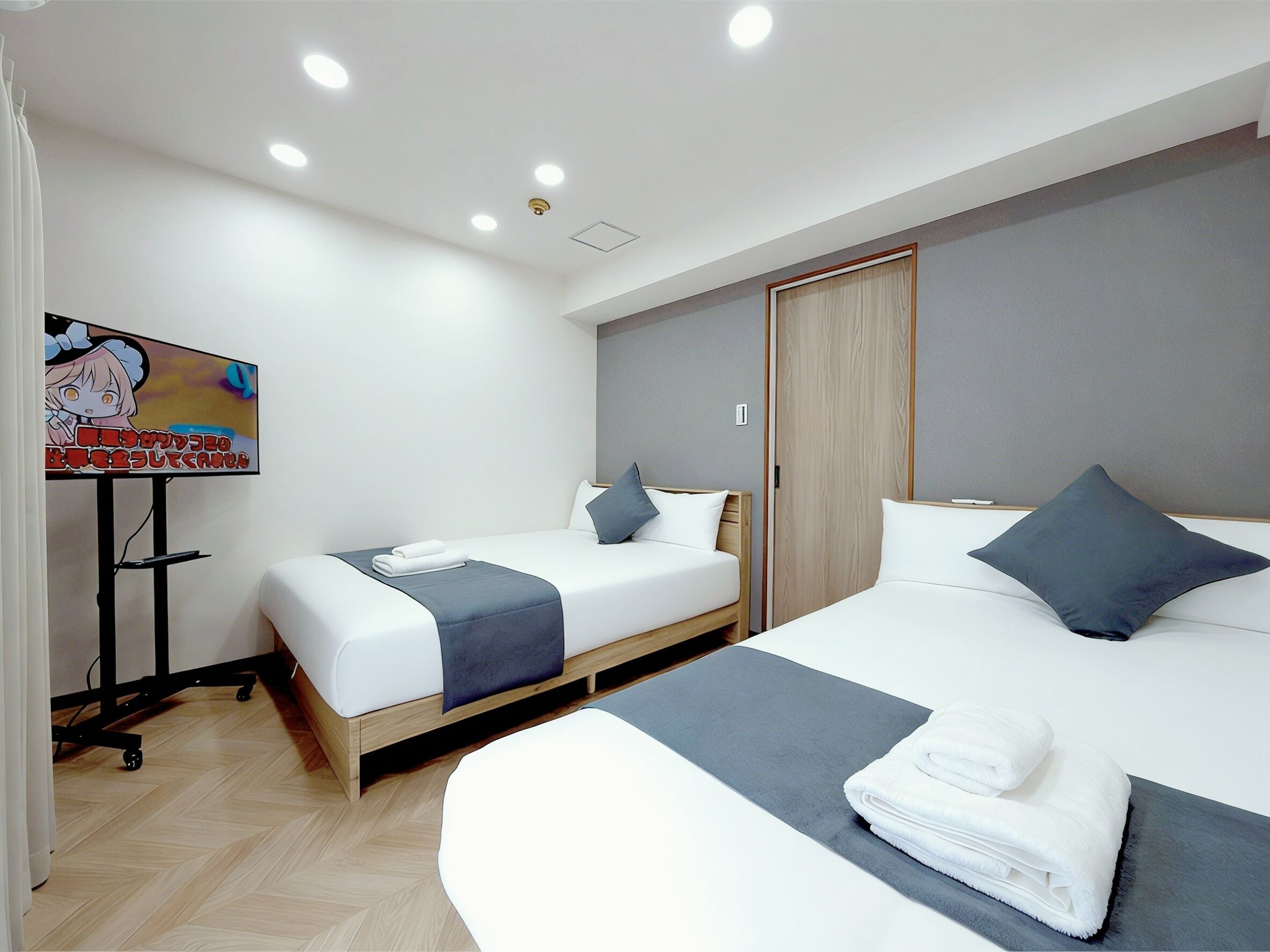 Economy Suite, Balcony, City View | Desk, blackout curtains, soundproofing, iron/ironing board