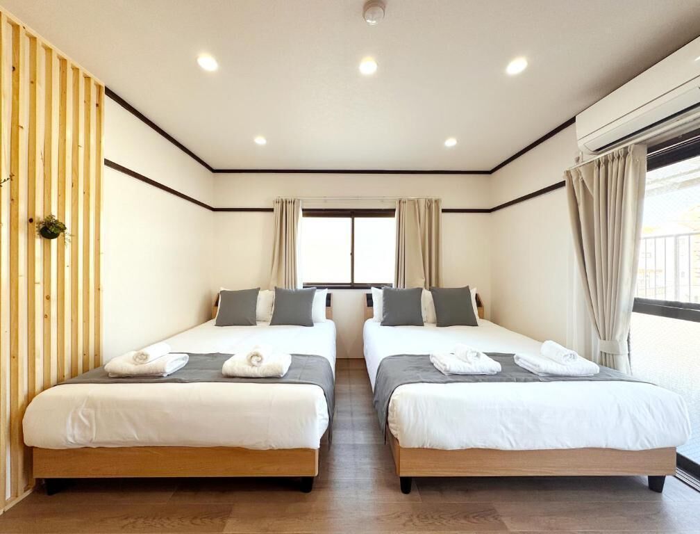 Family Quadruple Room, Balcony, City View | Desk, blackout curtains, soundproofing, iron/ironing board