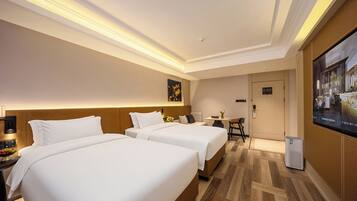 Premium bedding, memory foam beds, minibar, desk