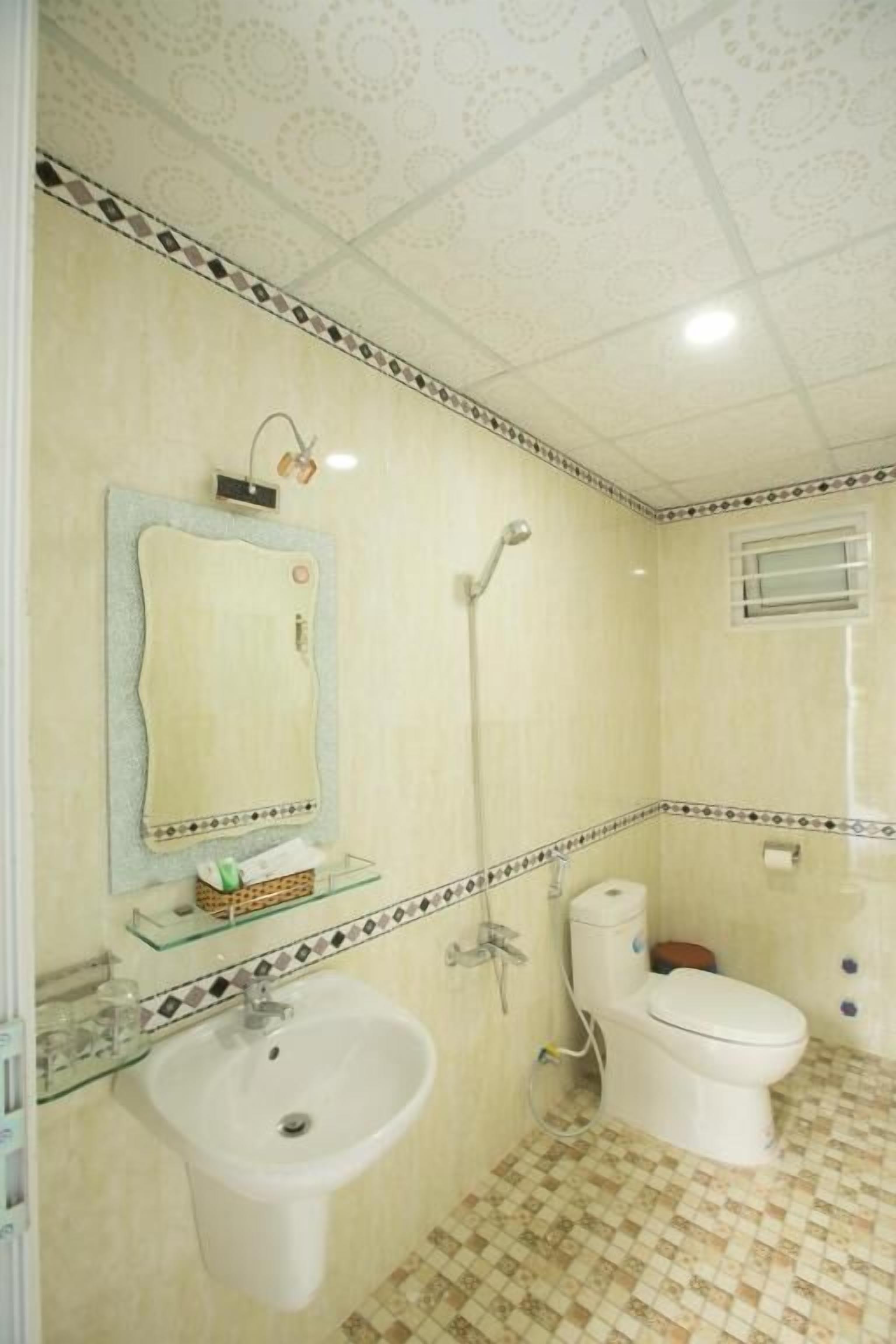 Shower, hair dryer, slippers, towels