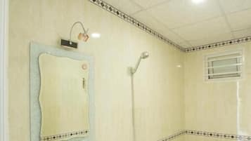 Shower, hair dryer, slippers, towels