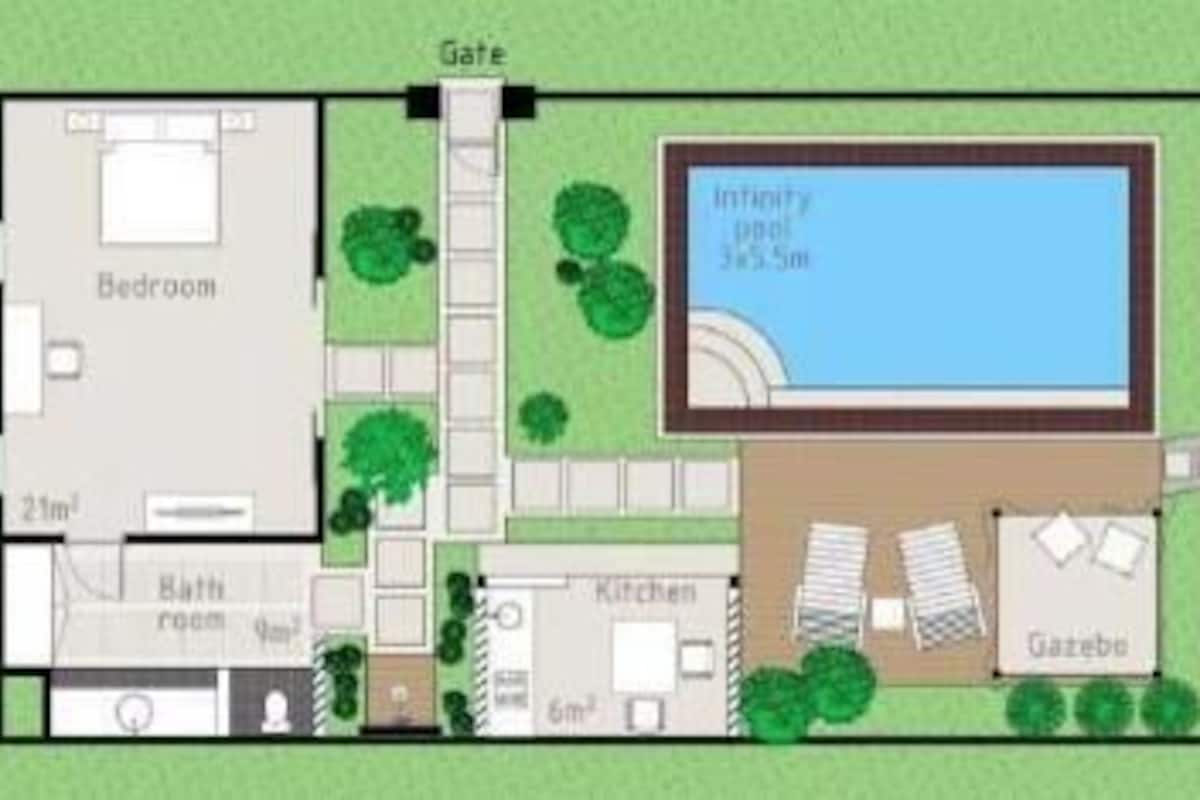 A house with a bedroom, bathroom, kitchen, and gazebo.