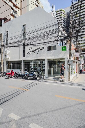 A building with a sign that reads 'Sway Haus' and a green cannabis leaf symbol. - CASA Sukhumvit 39 (Bangkok)