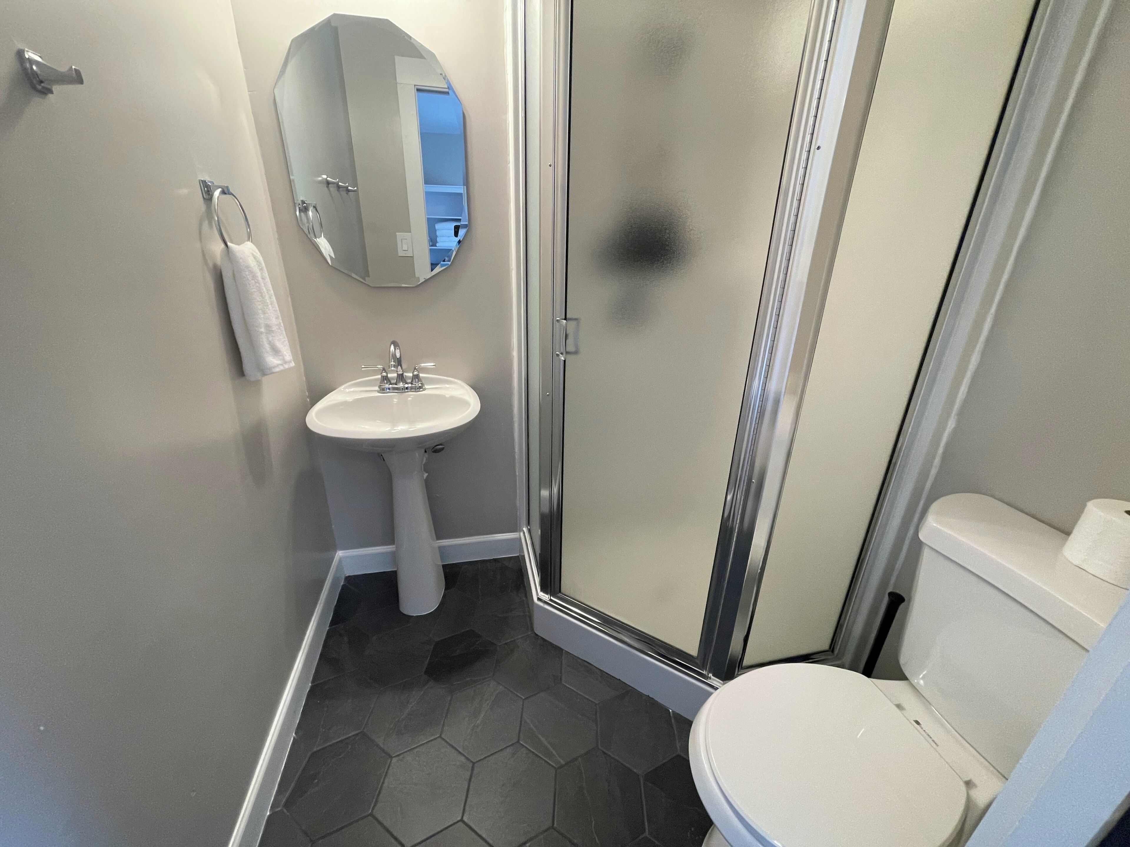 Shower, hair dryer, towels, soap