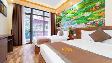 Premium bedding, laptop workspace, blackout drapes, soundproofing