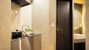 A modern kitchen with a stainless steel refrigerator, a stove, and a sink. - A 5-minute walk from Yoyogi Station on the JR Yamanote Line; an apartment for 3 people (渋谷区)