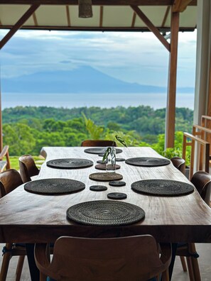 Outdoor dining - Infinity Pool Villa · Ocean & Volcano Views · Private Hillside Retreat (Nusa Penida)
