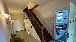 A staircase leading to a dining area with a view of the outdoors.