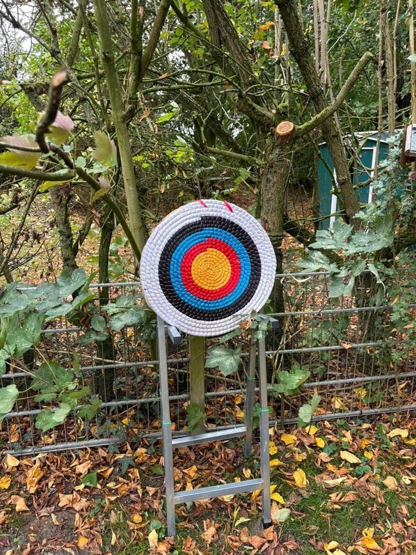 A target-like structure in a garden setting.