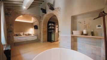 Junior Suite, Garden View | In-room safe, desk, soundproofing, iron/ironing board