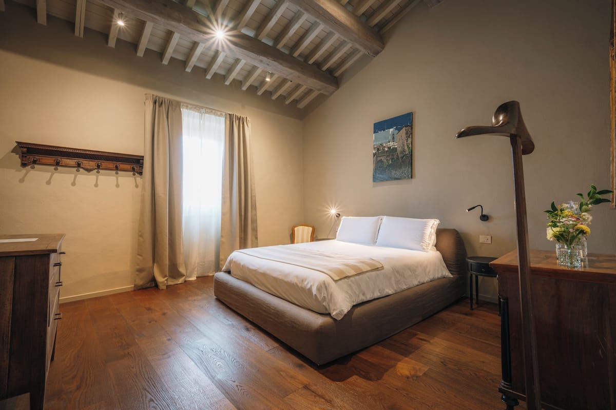 Deluxe Suite, Garden View | In-room safe, desk, soundproofing, iron/ironing board