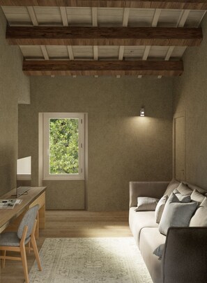 Suite familiare, vista giardino | Area soggiorno