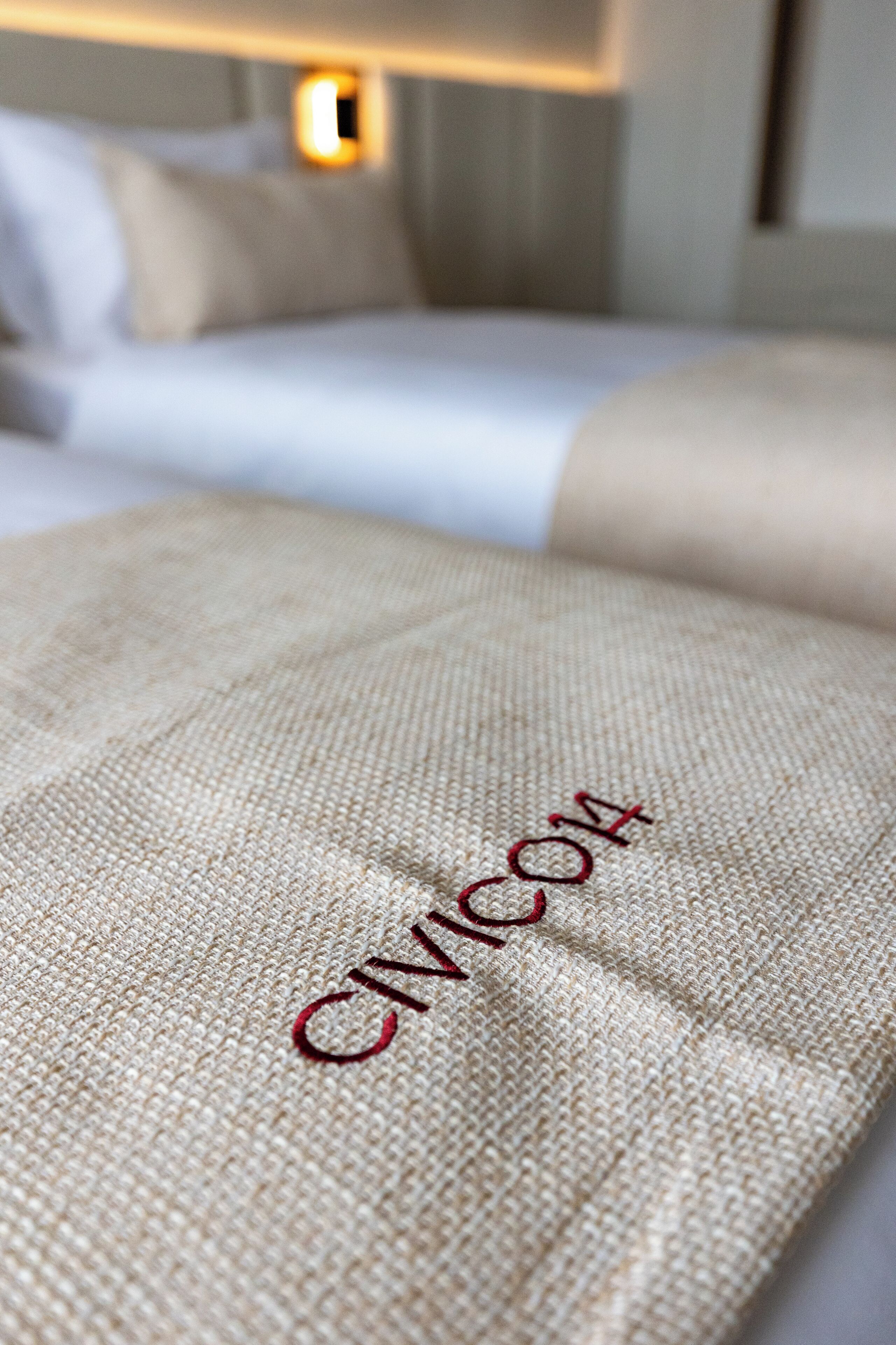 A close-up of a textured fabric with the word 'CIMICORE' embroidered on it.