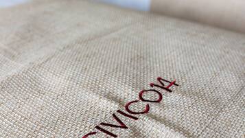 A close-up of a textured fabric with the word 'CIMICORE' embroidered on it.
