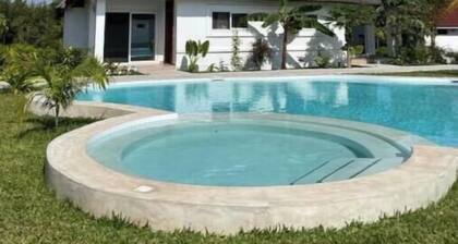 Botanica Suites Apt. 8 | Poolfront Apartment with Private Garden & Terrace