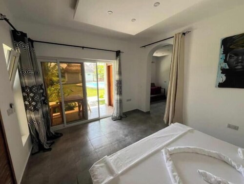Botanica Suites Apt. 8 | Poolfront Apartment with Private Garden & Terrace