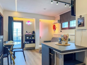 Penthouse, vista a la ciudad | Área de sala de estar