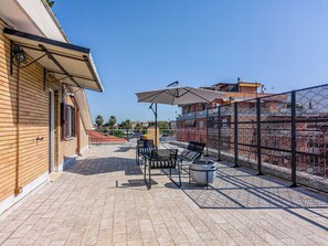 Penthouse, vista a la ciudad | Terraza o patio