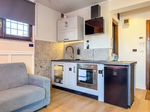 Penthouse, vista a la ciudad | Cocina privada