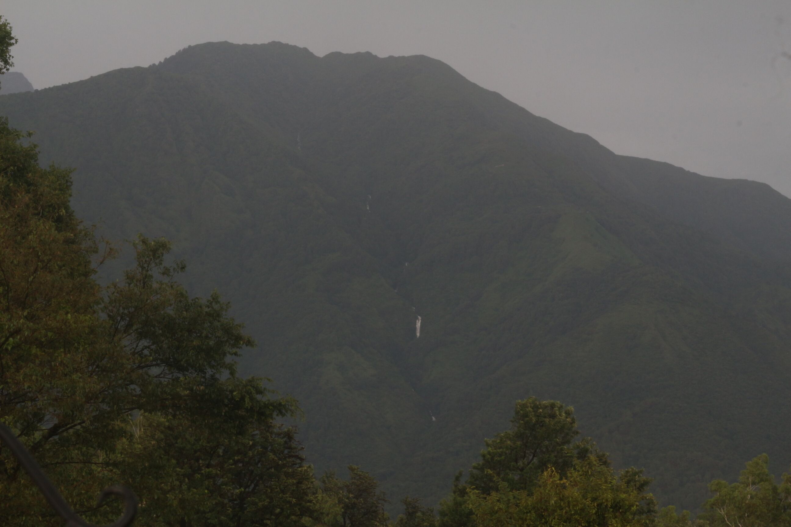 A mountain with a waterfall.
