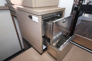 A compact kitchen with a built-in oven and a microwave. - Sun-kissed Sailing Adventure in Split-Dalmatia, Croatia (Trogir)