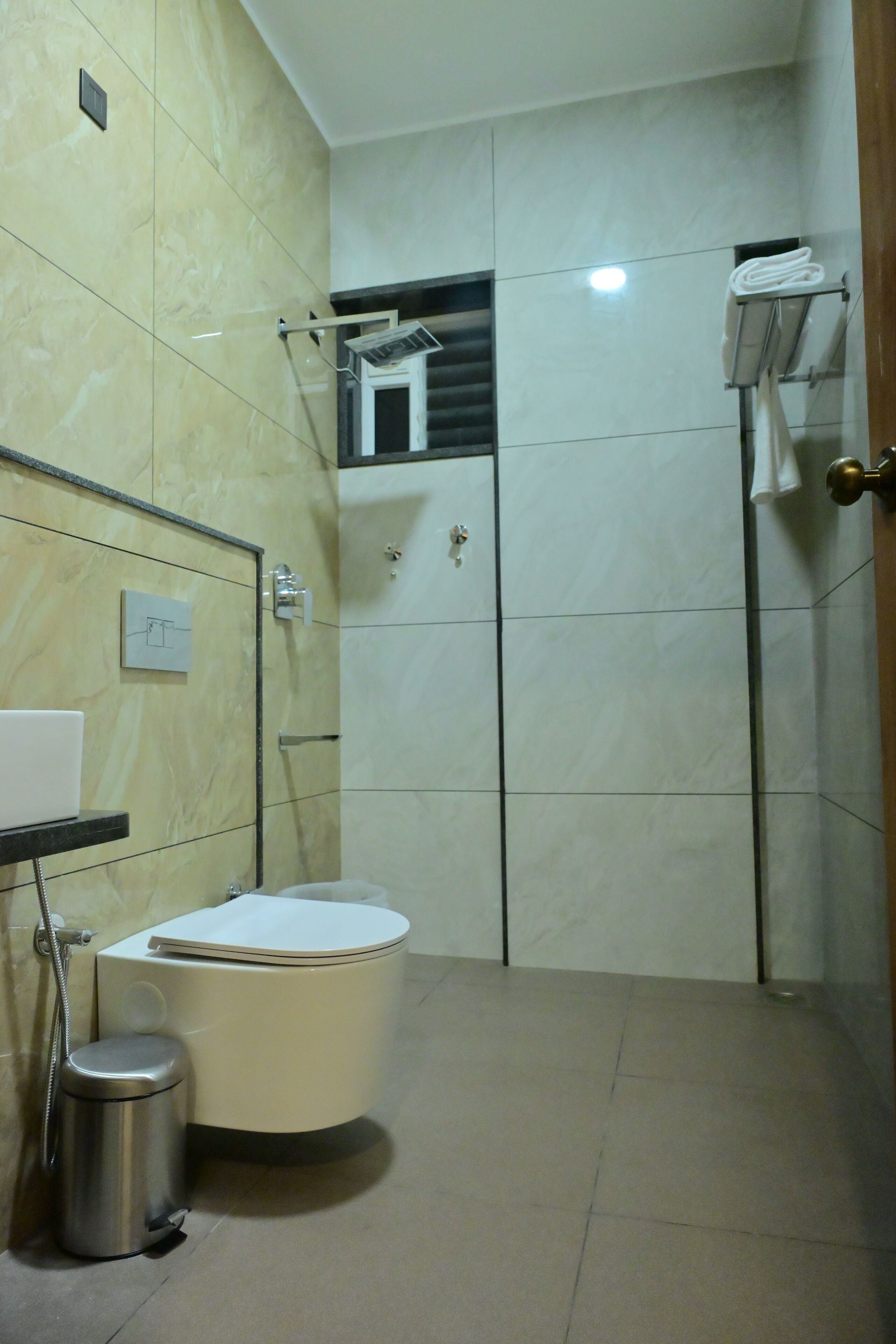 Shower, designer toiletries, hair dryer, towels