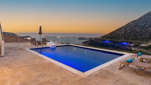 A swimming pool with lounge chairs and a view of the sea. - Brikis Villa 1 - With Private Pool (Mylopotamos)