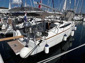 A marina with multiple sailboats docked, including a white yacht named 'Lydia' with a visible engine and a Dutch flag. - Sun-Kissed Sailing Adventure in Zadar, Croatia (Bibinje)