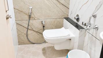 Shower, rainfall showerhead, slippers, towels