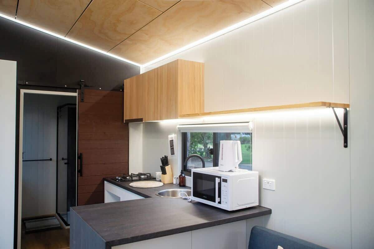 Fridge, electric kettle, cookware/dishes/utensils