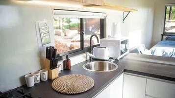 Fridge, electric kettle, cookware/dishes/utensils