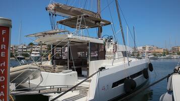 A marina with a boat named 'Sofia' docked, featuring a cabin, a covered deck area, and a number '4.1' on the side.