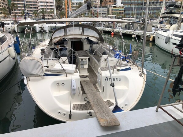 A marina with boats docked, including one named 'Arana.'