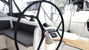 A boat's steering wheel, control panel, and wooden deck. - Sun-Kissed Sailing Adventure in the Ionian Islands, Lefkada (Lefkada)