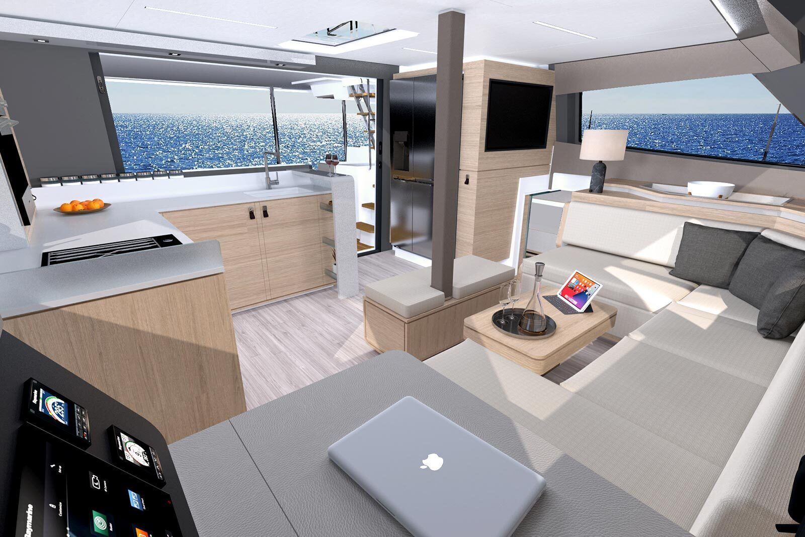 Et moderne yachtinteriør med et køkken, spiseområde og en lounge med en bærbar computer samt et bakkesæt.