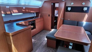 A compact galley with a sink, stove, and storage cabinets. - Sun-kissed Sailing Adventure in the Ionian Islands (Preveza)