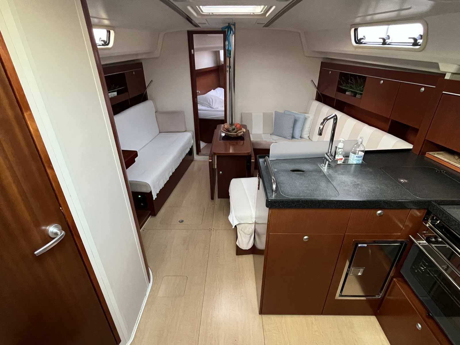 A compact kitchen with a sink, stove, and countertop.
