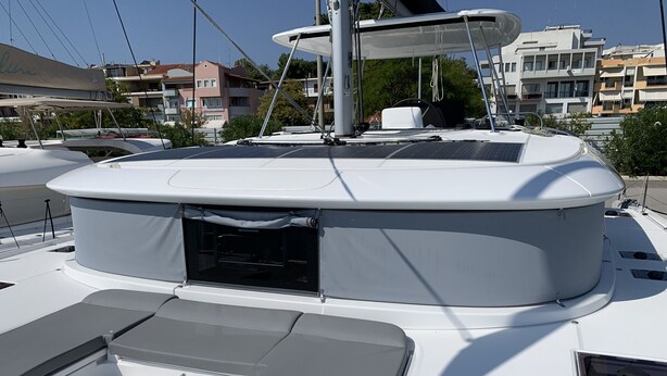 A boat with a covered deck area, a small enclosed space, and a seating area. - Sun-kissed Sailing Adventure in the Ionian Islands (Preveza)