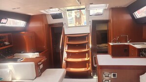 A compact galley with a stove, sink, and storage cabinets. - Sun-Kissed Sailing Adventure in the Ionian Islands, Lefkada (Lefkada)
