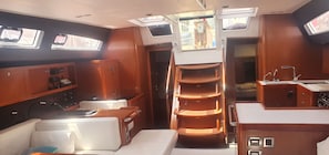 A compact galley with a stove, sink, and storage cabinets. - Sun-Kissed Sailing Adventure in the Ionian Islands, Lefkada (Lefkada)