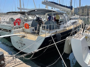 A marina with boats docked, including one named 'Ulterra.'