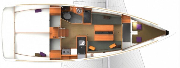 Ein Bootsinnenraum mit Essbereich, Küche und Sitzgelegenheit.