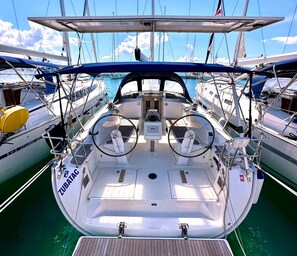 A sailboat deck with a steering wheel, helm station, and 'ZUBATA' branding. - Sun-Kissed Sailing Adventure in Zadar, Croatia (Bibinje)