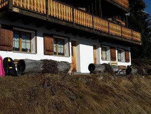 A traditional chalet with wooden balconies, large logs, and a rustic setting. - Konkordia 2 EG Süd-Ost Appartement/Fewo, Dusche oder Bad, WC by Interhome (Bettmeralp)