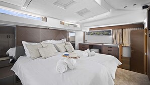 A modern, well-lit bedroom with a large bed, a desk, and a wardrobe. - Sun-Kissed Sailing Adventure in Split, Croatia (Split)