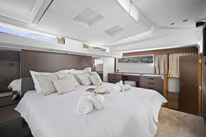 A modern, well-lit bedroom with a large bed, a desk, and a wardrobe. - Sun-Kissed Sailing Adventure in Split, Croatia (Split)